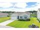 Aerial view of home with well-manicured lawn and pond at 2002 Sweetflag Dr., Longs, SC 29568