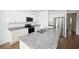 Modern kitchen with granite countertops, stainless steel appliances, and ample cabinet space at 2002 Sweetflag Dr., Longs, SC 29568