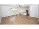 Spacious living room with hardwood floors, natural light, and an open-concept design at 2002 Sweetflag Dr., Longs, SC 29568