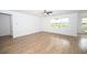 Open living room with hardwood floors and an abundance of natural light at 2002 Sweetflag Dr., Longs, SC 29568