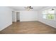 Inviting living room featuring hardwood floors, a ceiling fan, and neutral wall colors at 2002 Sweetflag Dr., Longs, SC 29568