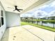 Covered patio with ceiling fan overlooking pond at 2002 Sweetflag Dr., Longs, SC 29568