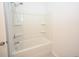 Clean bathroom with a shower-tub combo featuring a shower head and built-in shelving at 2002 Sweetflag Dr., Longs, SC 29568