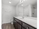 Well-lit bathroom features a modern vanity, large mirror, and a combination tub/shower at 201 Gray Owl Dr., Conway, SC 29527