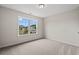 A bright bedroom featuring neutral carpet and a window with a view of the outdoors at 201 Gray Owl Dr., Conway, SC 29527
