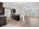 Modern kitchen with dark wood cabinets, granite countertops, and stainless steel appliances at 201 Gray Owl Dr., Conway, SC 29527