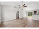 Spacious living room featuring an open layout, hardwood floors, and access to the outdoors through sliding glass doors at 201 Gray Owl Dr., Conway, SC 29527