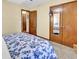 Bedroom with a double closet, access to the bathroom, and patterned comforter at 201 Surrey Ln., Myrtle Beach, SC 29579