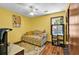 Bedroom featuring a twin bed with a teddy bear, a ceiling fan, and hardwood floors at 201 Surrey Ln., Myrtle Beach, SC 29579
