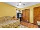 Bedroom featuring a twin bed with a teddy bear, a ceiling fan, and hardwood floors at 201 Surrey Ln., Myrtle Beach, SC 29579