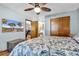 Comfortable bedroom featuring a decorative ceiling fan, closet, and view to adjacent areas at 201 Surrey Ln., Myrtle Beach, SC 29579
