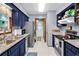 Efficient kitchen with granite countertops, stainless steel appliances and stylish navy blue cabinets at 201 Surrey Ln., Myrtle Beach, SC 29579