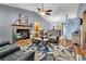Inviting living room featuring a brick fireplace, vaulted ceilings, and comfortable leather furniture at 201 Surrey Ln., Myrtle Beach, SC 29579