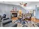Inviting living room featuring a brick fireplace, vaulted ceilings, and comfortable leather furniture at 201 Surrey Ln., Myrtle Beach, SC 29579