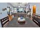 Open-concept space showcasing dining, living area, and a glimpse of the front entrance at 201 Surrey Ln., Myrtle Beach, SC 29579