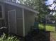 Backyard shed with vinyl siding and a simple design near a chain link fence at 201 Surrey Ln., Myrtle Beach, SC 29579