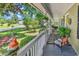 Inviting front porch with comfortable seating and decorative plants, perfect for relaxation at 201 Surrey Ln., Myrtle Beach, SC 29579