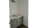 Bathroom vanity with gray cabinets, a white countertop, brushed nickel hardware, and modern lighting at 2075 Lees Landing Circle, Conway, SC 29526