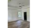 This is a primary bedroom featuring a trey ceiling, ceiling fan and wood-look flooring at 2075 Lees Landing Circle, Conway, SC 29526
