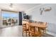 Inviting interior with an ocean view through sliding doors, featuring wood-look flooring and stylish accents at 2201 S Ocean Blvd. # 103, Myrtle Beach, SC 29577