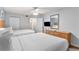 Comfortable bedroom featuring two beds, a dresser and a mirror at 2201 S Ocean Blvd. # 103, Myrtle Beach, SC 29577