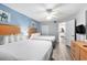 Inviting bedroom features two beds, light wood dresser, and doorway to the kitchen at 2201 S Ocean Blvd. # 103, Myrtle Beach, SC 29577