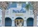 Close-up of the Paradise Resort entrance, showcasing its architectural details and landscaping at 2201 S Ocean Blvd. # 103, Myrtle Beach, SC 29577