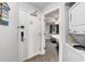 Functional laundry area with gray walls and modern appliances including a full size washer and dryer at 2201 S Ocean Blvd. # 103, Myrtle Beach, SC 29577