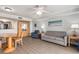 Charming living area with a sofa, Murphy bed, and dining area under a ceiling fan at 2201 S Ocean Blvd. # 103, Myrtle Beach, SC 29577