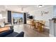 Comfortable living space featuring modern furnishings, a TV, and access to a private balcony at 2201 S Ocean Blvd. # 103, Myrtle Beach, SC 29577