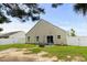 View of a charming backyard featuring a well-maintained lawn, patio area, and a privacy fence at 221 Tibton Circle, Myrtle Beach, SC 29588