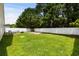 Spacious backyard with lush green grass, privacy fence, and mature trees at 221 Tibton Circle, Myrtle Beach, SC 29588