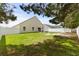 Spacious backyard with a well-kept lawn, patio, and a secure white fence for added privacy at 221 Tibton Circle, Myrtle Beach, SC 29588