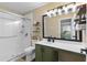 Bathroom showcasing a walk-in shower with glass doors, vanity, and a view into the bedroom at 221 Tibton Circle, Myrtle Beach, SC 29588