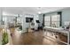 Bright home office and workout space, adjacent to the living room and featuring dark wood floors at 221 Tibton Circle, Myrtle Beach, SC 29588