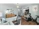 Bright, neutral-toned home office with a desk, wood floors, and view into the living area at 221 Tibton Circle, Myrtle Beach, SC 29588