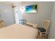 Bright bedroom with beach artwork on the television and a queen bed at 2311 S Ocean Blvd. # 437, Myrtle Beach, SC 29577