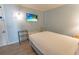 Cozy bedroom featuring a television, queen bed, and light blue painted walls at 2311 S Ocean Blvd. # 437, Myrtle Beach, SC 29577