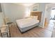 Bright bedroom with a queen bed, nautical decor, and light blue walls at 2311 S Ocean Blvd. # 437, Myrtle Beach, SC 29577