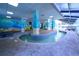Indoor pool area with decorative wall art, water features, and comfortable lounge chairs at 2311 S Ocean Blvd. # 437, Myrtle Beach, SC 29577