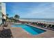 Poolside lounge area offering a relaxing spot to enjoy the sunshine with the beach in the background at 2311 S Ocean Blvd. # 437, Myrtle Beach, SC 29577