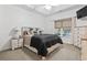 Comfortable bedroom with a black comforter, bedside tables, and a window seat at 236 Palm Cove Circle, Myrtle Beach, SC 29588