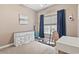 Bedroom with beach decor, weights and equipment on the floor by the window at 236 Palm Cove Circle, Myrtle Beach, SC 29588