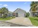 Charming single-story home with a well-manicured lawn, an attached garage, and inviting curb appeal at 236 Palm Cove Circle, Myrtle Beach, SC 29588