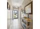 Inviting hallway with tiled floor, decorative mirror, and console table at 236 Palm Cove Circle, Myrtle Beach, SC 29588