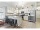 Spacious kitchen with bar stool seating, tile flooring, and stainless steel appliances at 236 Palm Cove Circle, Myrtle Beach, SC 29588