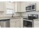 Updated kitchen with stainless steel appliances, granite countertops, and stylish cabinetry at 236 Palm Cove Circle, Myrtle Beach, SC 29588