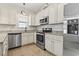 Well-lit kitchen features stainless steel appliances and granite countertops at 236 Palm Cove Circle, Myrtle Beach, SC 29588