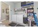 Laundry room with washer, dryer, shelving, and storage for cleaning supplies at 236 Palm Cove Circle, Myrtle Beach, SC 29588