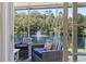 Cozy screened porch seating area with beautiful water views and comfortable seating arrangement at 236 Palm Cove Circle, Myrtle Beach, SC 29588